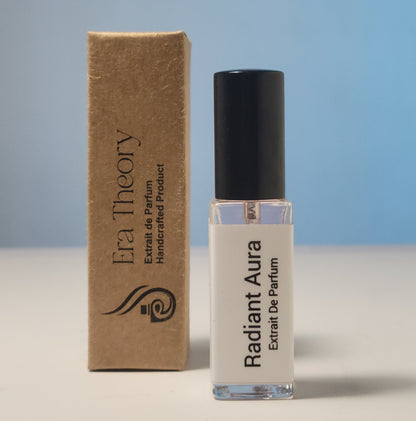 Era Theory “Radiant Aura” inspired by Bombshell — bright fruity-floral perfume bottle with peony and passionfruit notes.