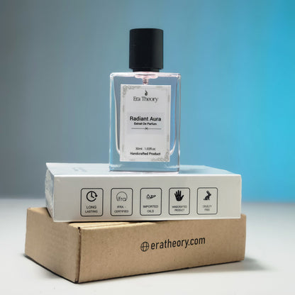 Era Theory “Radiant Aura” inspired by Bombshell — bright fruity-floral perfume bottle with peony and passionfruit notes.