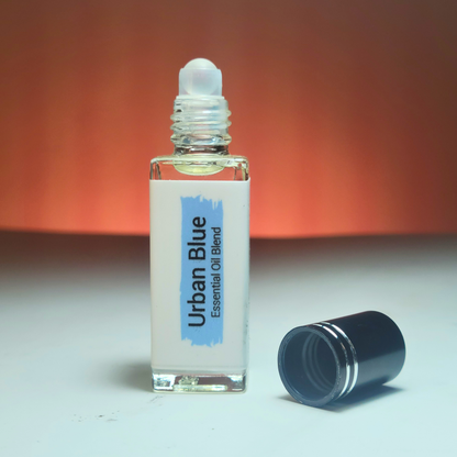 Discover Urban Blue, a woody aromatic perfume inspired by Bleu de Chanel. A sophisticated blend of zesty grapefruit, ginger, and smoky incense. Handcrafted by Era Theory.